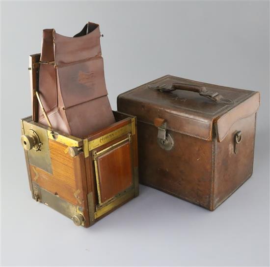Ansel Adams (1902-1984), a rare Adams & Co. Minex De Luxe tropical mahogany and brass camera, 5 x 4in., the original leather case stamp
